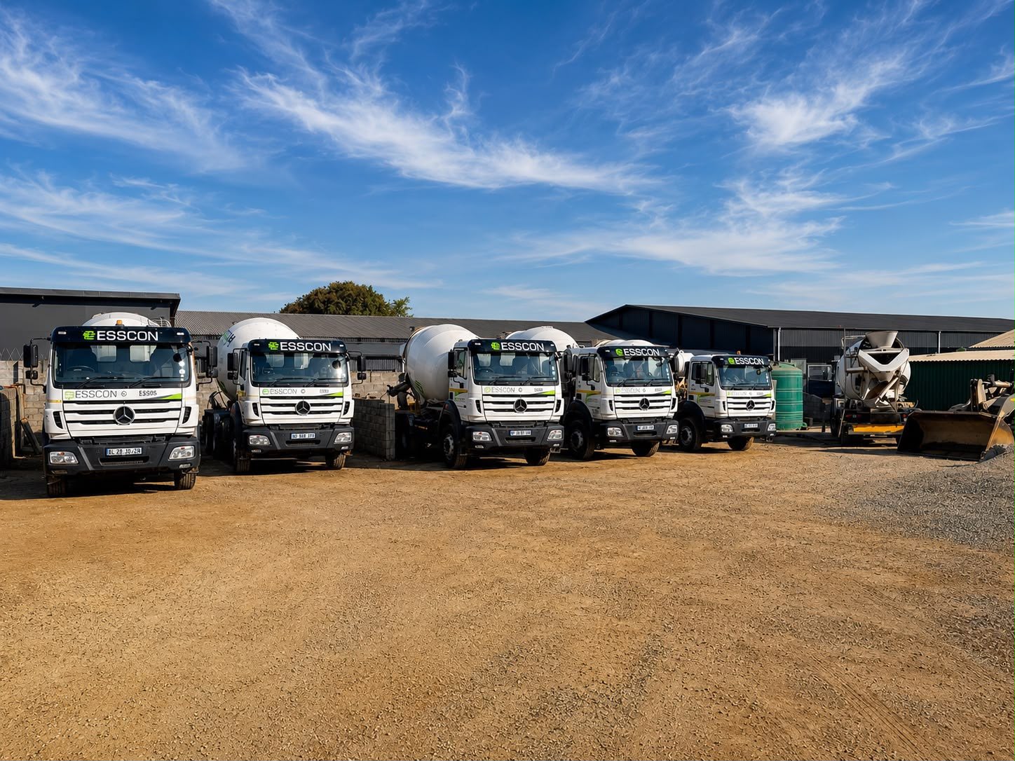 Esscon Concrete mixer fleet lined up in the yard