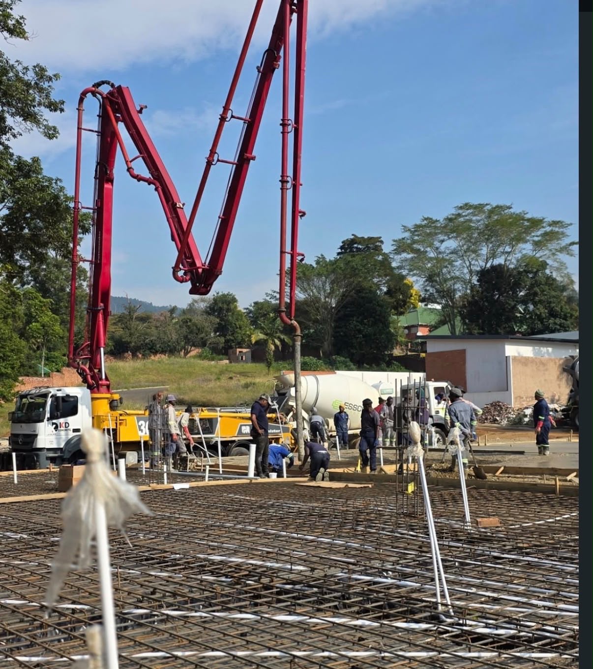 Esscon concrete pump boom extended on site