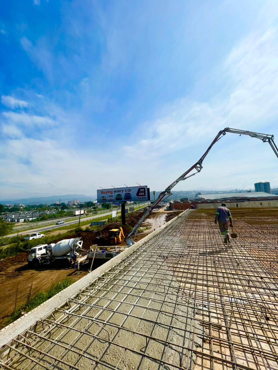 Concrete being pumped onto an elevated slab